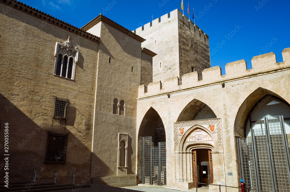 Zaragoza, Aragon, Spain - February 14th, 2019 : Aragonese Courtyard, Troubadour Tower and Chapel of San Martin within the Aljaferia Palace complex.