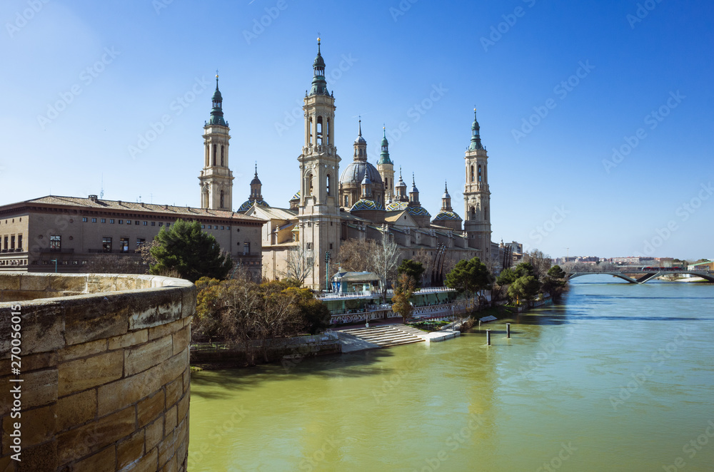 Zaragoza, Aragon, Spain - February 14th, 2019 : Basilica of Our Lady of the Pillar by the river Ebro. It is reputed to be the first church dedicated to Mary in history.