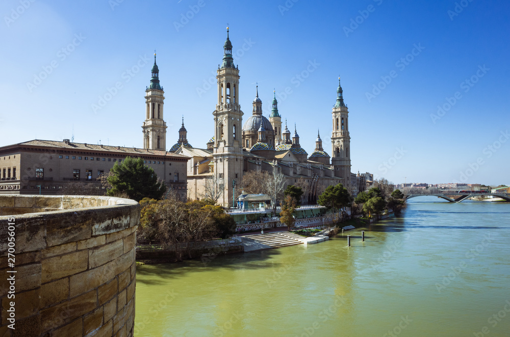 Zaragoza, Aragon, Spain - February 14th, 2019 : Basilica of Our Lady of the Pillar by the river Ebro. It is reputed to be the first church dedicated to Mary in history. Zaragoza, Aragon, Spain - February 14th, 2019 : Basilica of Our Lady of the Pillar by the river Ebro. It is reputed to be the first church dedicated to Mary in history.