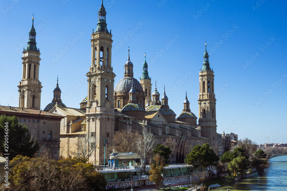 Zaragoza, Aragon, Spain - February 14th, 2019 : Basilica of Our Lady of the Pillar by the river Ebro. It is reputed to be the first church dedicated to Mary in history.