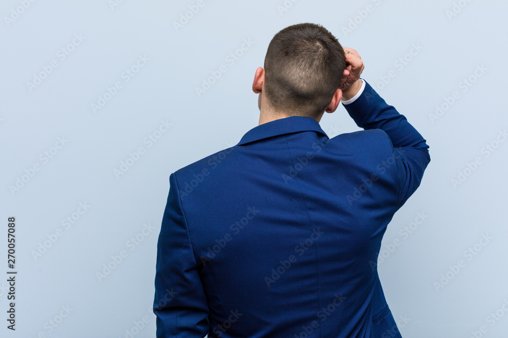 Young business caucasian man from behind thinking about something. Young business caucasian man from behind thinking about something.