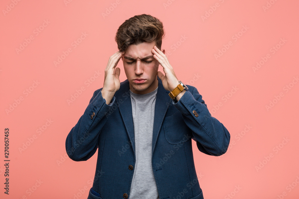 Young business natural man touching temples and having headache. Young business natural man touching temples and having headache.