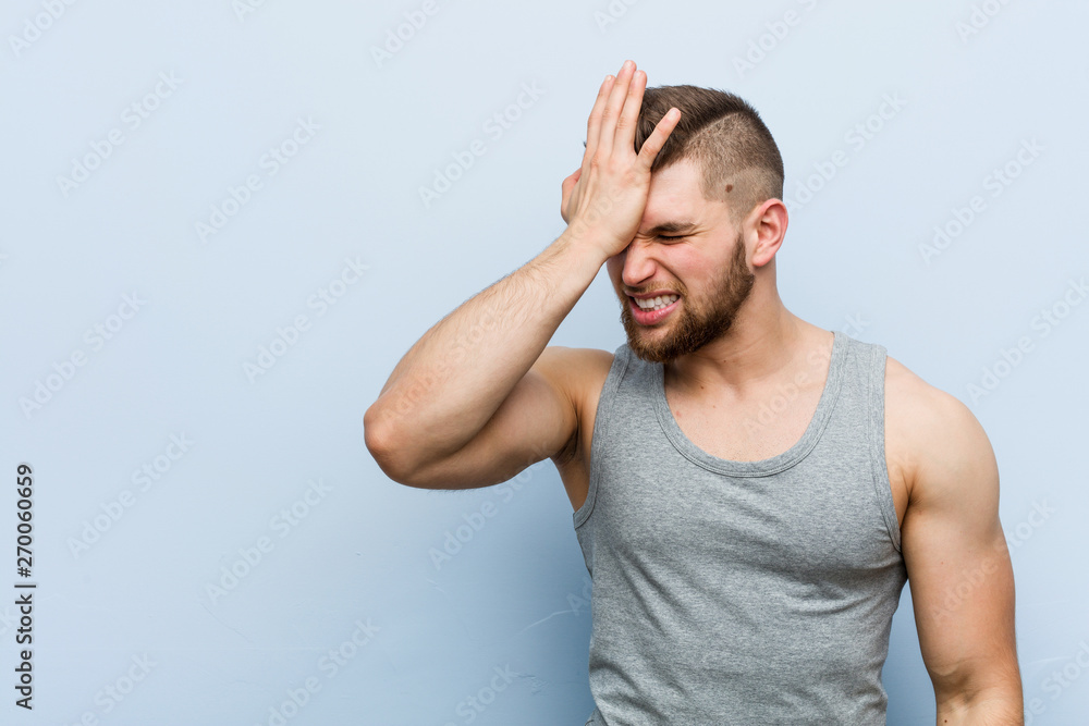 Young handsome fitness man forgetting something, slapping forehead with palm and closing eyes. Young handsome fitness man forgetting something, slapping forehead with palm and closing eyes.