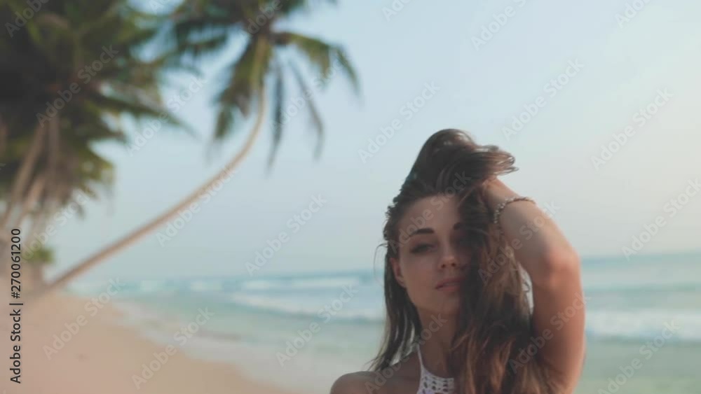 Woman posing against beach Woman posing against beach