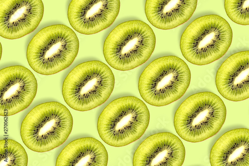 kiwi fruit sliced pattern on green background