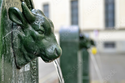 A triptych of drinking water fountains photo