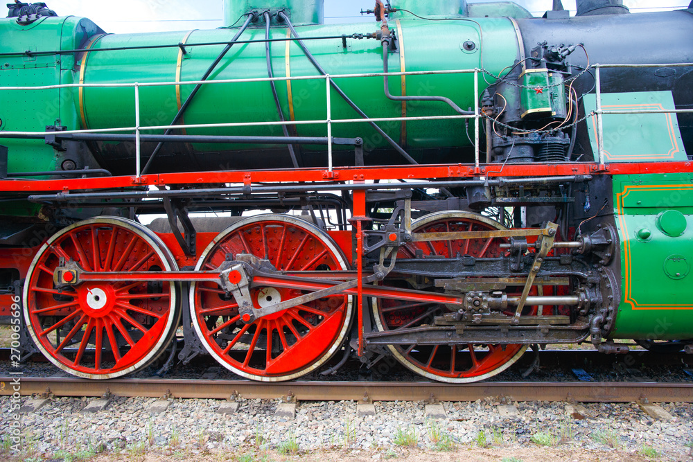 The driving mechanism of the locomotive. Drive wheels and crank mechanism The driving mechanism of the locomotive. Drive wheels and crank mechanism