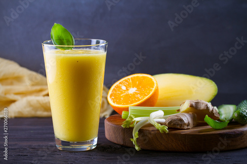 Mango Orange Ginger Cucumber and Celery Smoothie. Fruit and Vegetable Smoothie - healthy diet and detox drink. horizontal