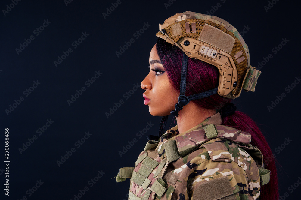 latin female indian soldier studio black background Stock Photo