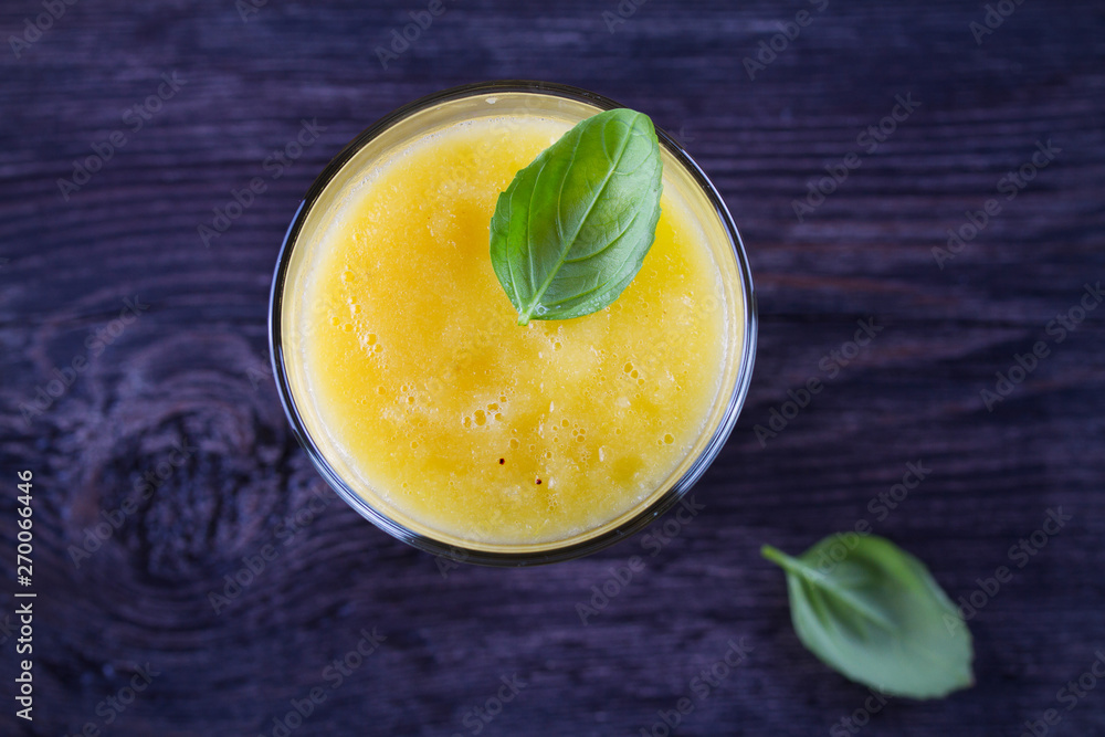 Mango Orange Ginger Cucumber and Celery Smoothie. Fruit and Vegetable Smoothie - healthy diet and detox drink. View from above, top studio shot Mango Orange Ginger Cucumber and Celery Smoothie. Fruit and Vegetable Smoothie - healthy diet and detox drink. View from above, top studio shot