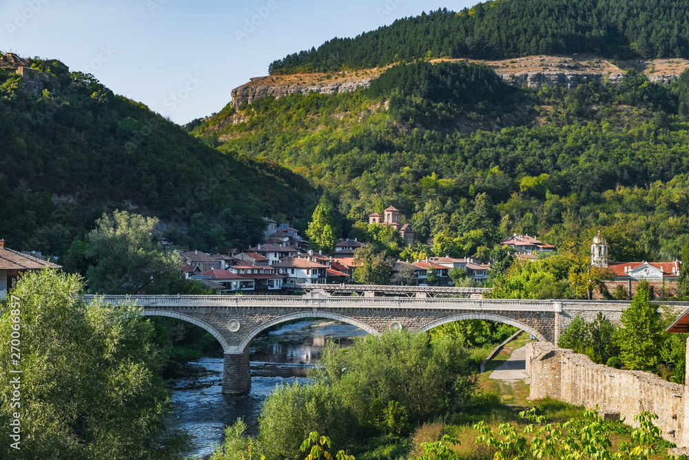 View of the Vladishki bridge over Yantra river and typical terrace architecture in Veliko Tarnovo, Bulgaria