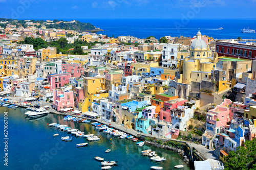 Fototapeta Naklejka Na Ścianę i Meble -  Beautiful island town in Italy. Aerial view overlooking the harbor and colorful pastel buildings of Procida.