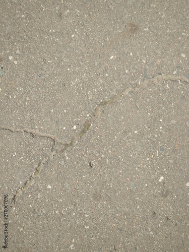 Background asphalt road with cracked