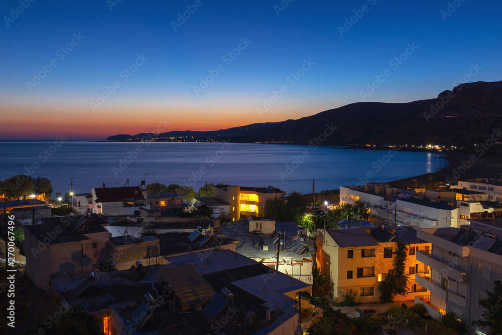 Aerial night view on Palaiochora town, south part of Crete island, Greece