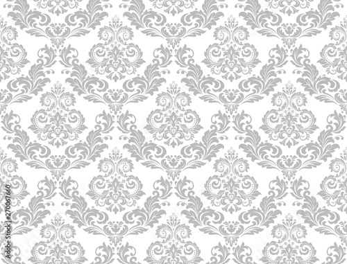 Wallpaper in the style of Baroque. Seamless vector background. White and grey floral ornament. Graphic pattern for fabric, wallpaper, packaging. Ornate Damask flower ornament.
