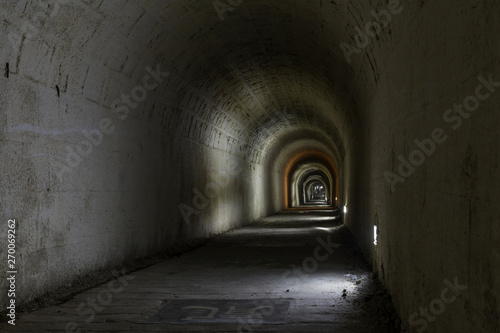 A dark  deserted underground tunnel