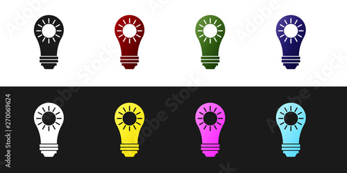 Set Solar energy panel icon isolated on black and white background. Sun and light bulb. Vector Illustration