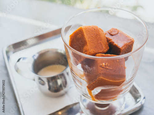 Thai milk tea ice cubes in glass