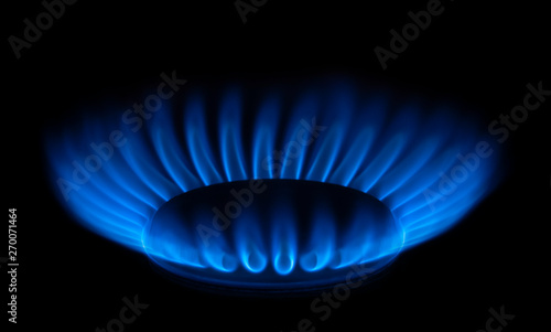 Foto Burning gas burner with blue flame on black background