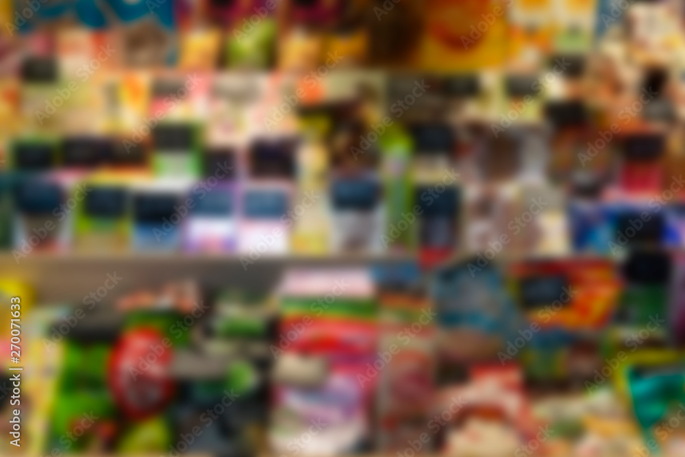 Fototapeta premium Blur supermarket background. Showcase with food (sweets, fruits, snacks)