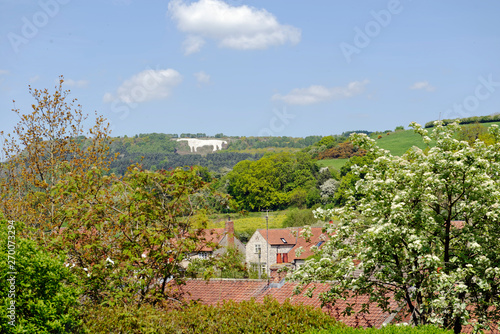 View across the rooftops of the iconic White Horse image on the hillside above the village of Kilburn in North Yorkshire, England