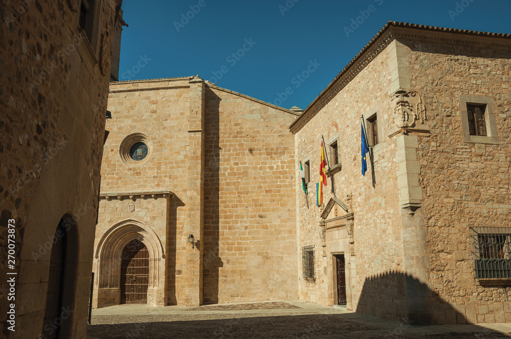 Small square in the middle of old buildings and a Cathedral at Caceres