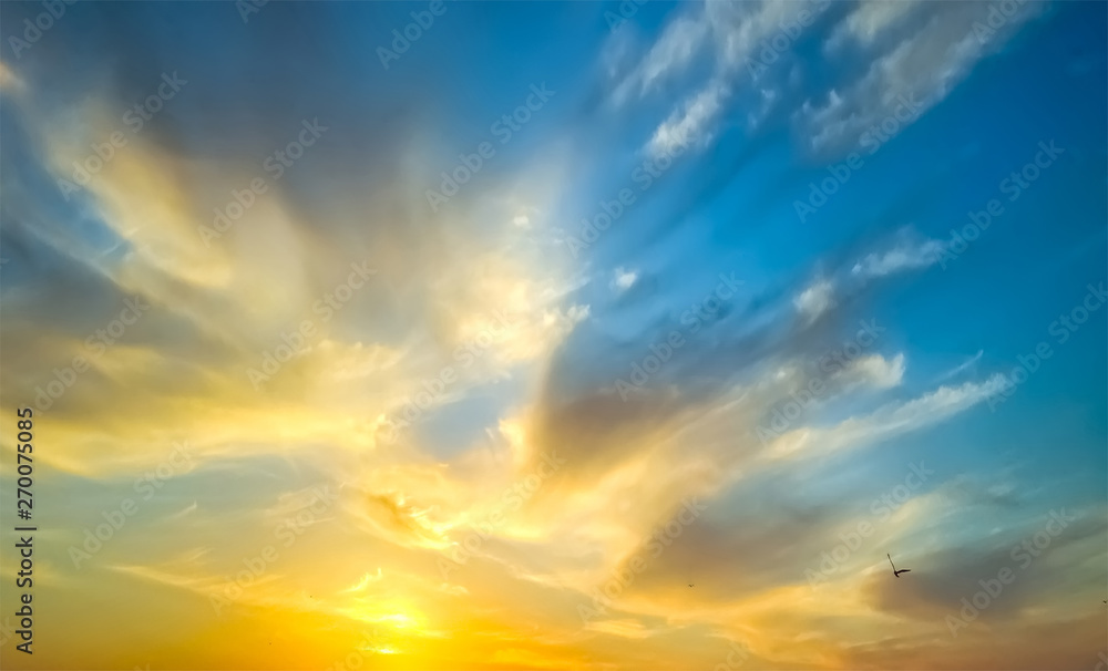 Epic dramatic sunset . Beautiful orange, yellow and blue colors sunset sky for background.