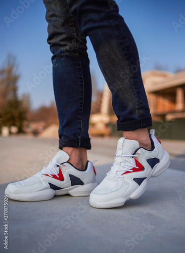 white sport shoes on the street