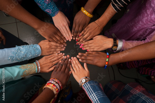 Hands of happy group of African people which stay together in circle