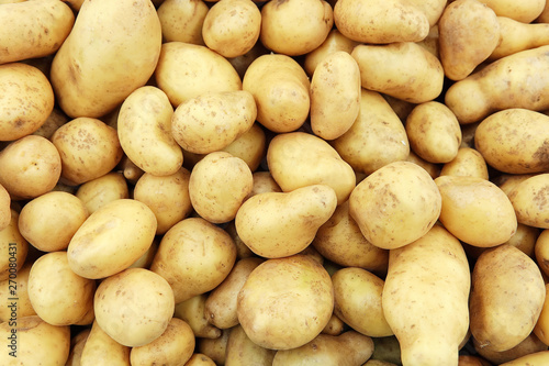 Raw potatoes closeup group
