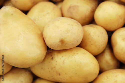 Raw potatoes closeup group