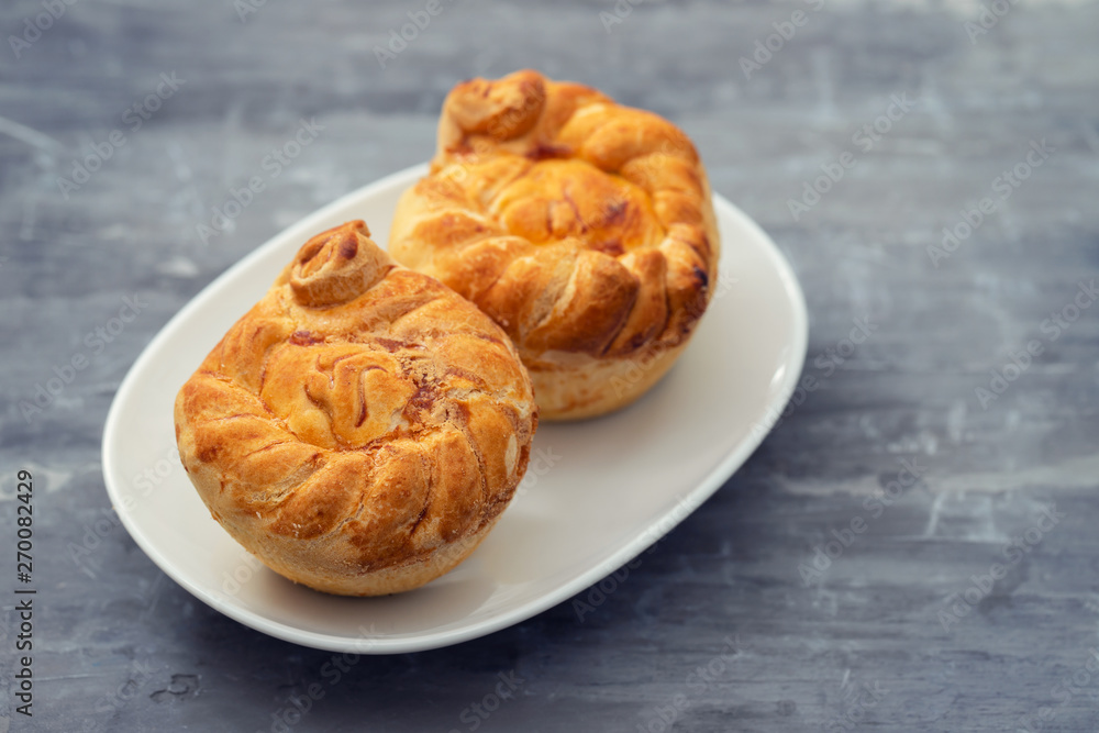 typical portuguese and brazilian chicken small pies on white dish typical portuguese and brazilian chicken small pies on white dish