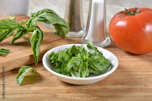 Fresh basil leaves on a cutting board