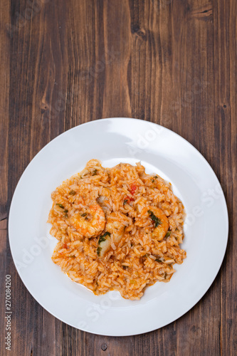 traditional portuguese dish rice with seafood in white dish