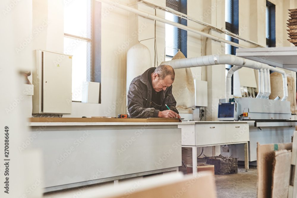 Portrait of a busy craftsman working at his workstation Portrait of a busy craftsman working at his workstation