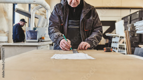 Cropped image of a craftsman working at his workstation