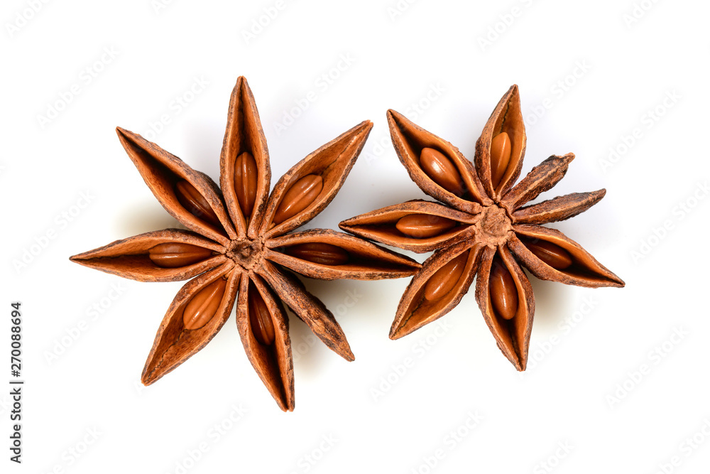 Star anise. Two star anise fruits. Macro close up Isolated on white background with shadow, top view of chinese badiane spice or Illicium verum. Star anise. Two star anise fruits. Macro close up Isolated on white background with shadow, top view of chinese badiane spice or Illicium verum.