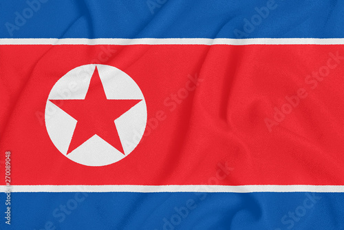 Flag of North Korea on textured fabric. Patriotic symbol