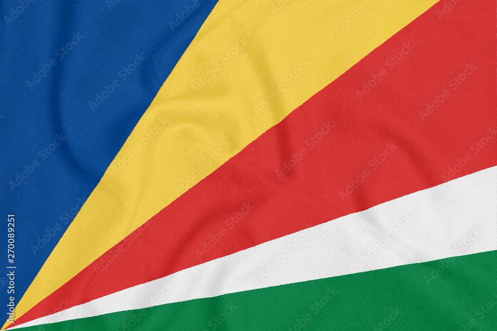 Flag of Seychelles on textured fabric. Patriotic symbol