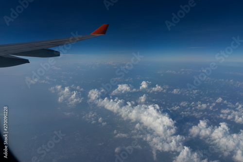 Airplane Flying in The Sky With Clouds