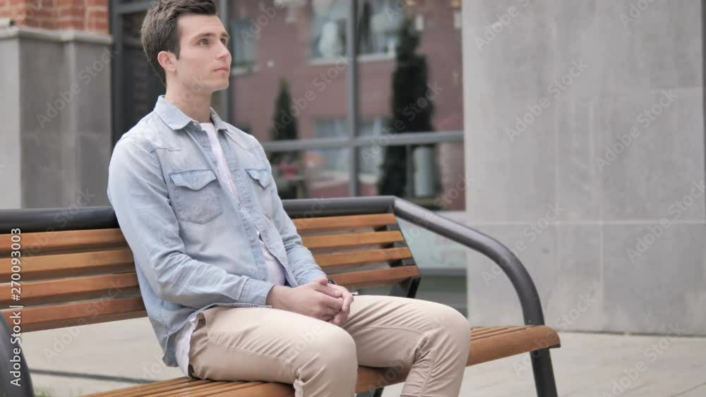 Serious Casual Young Man Sitting Outdoor Serious Casual Young Man Sitting Outdoor
