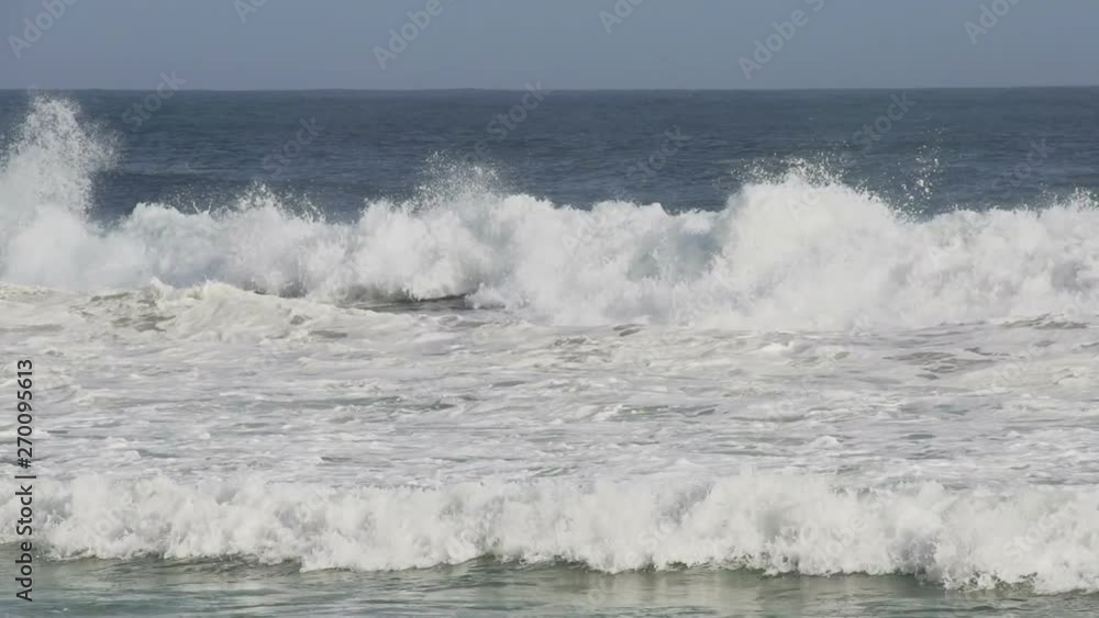 Slow motion waves crashing on the beach Slow motion waves crashing on the beach