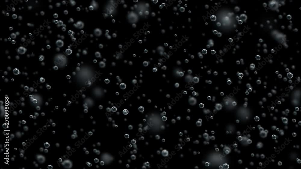 Macro shooting of slowly floating champagne bubbles on a black background. Slow motion. Macro shooting of slowly floating champagne bubbles on a black background. Slow motion.