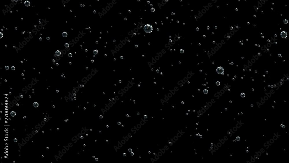 Bubbles of carbon dioxide slowly rise in absolutely transparent water on a black background. Bubbles of carbon dioxide slowly rise in absolutely transparent water on a black background.