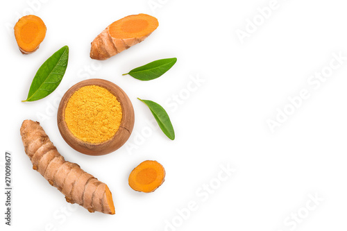 Turmeric powder and turmeric root isolated on white background with copy space for your text. Top view. Flat lay photo