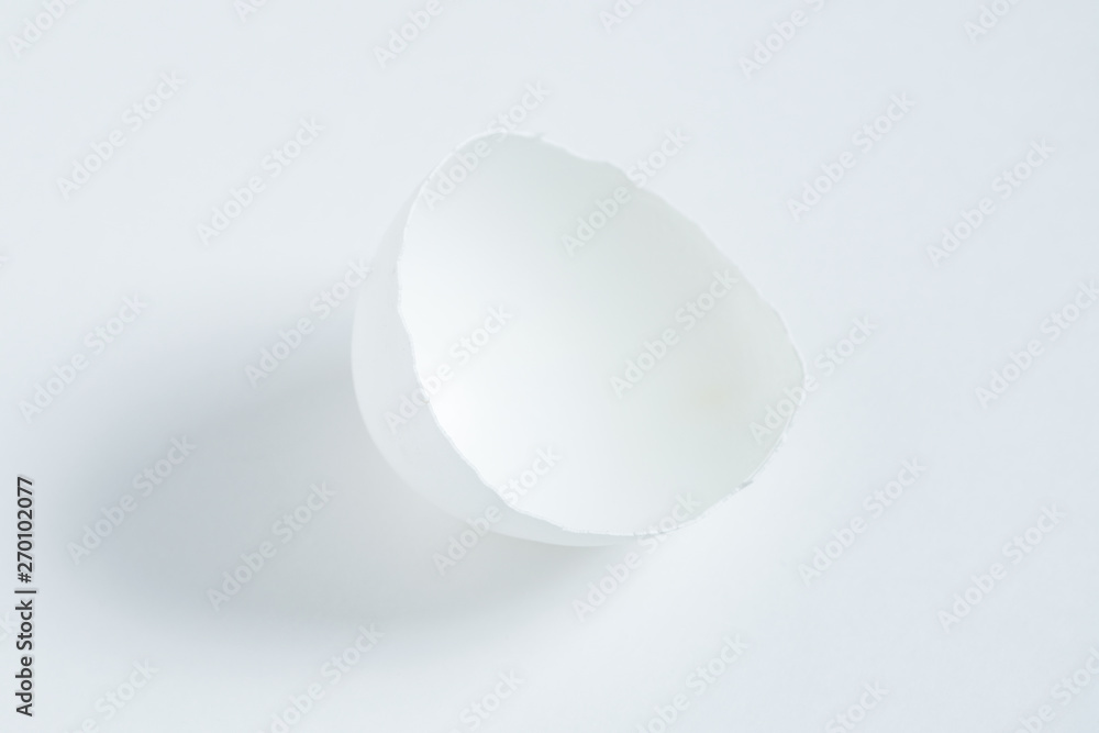 Half an egg shell on a white background. Half an egg shell on a white background.