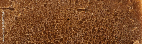 panoramic shot of brown fresh textured bread