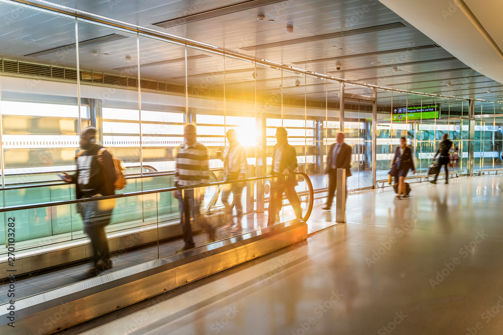 Fototapeta premium Airport, people rushing for their flights, long corridor, Dublin, Sunrise