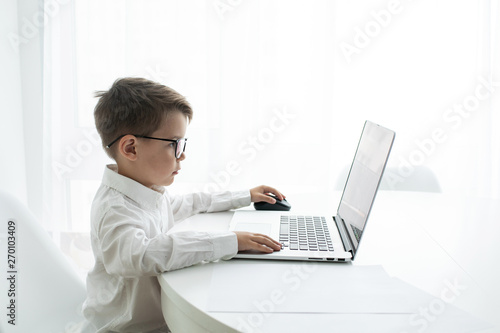 Young businessman working with laptop at office