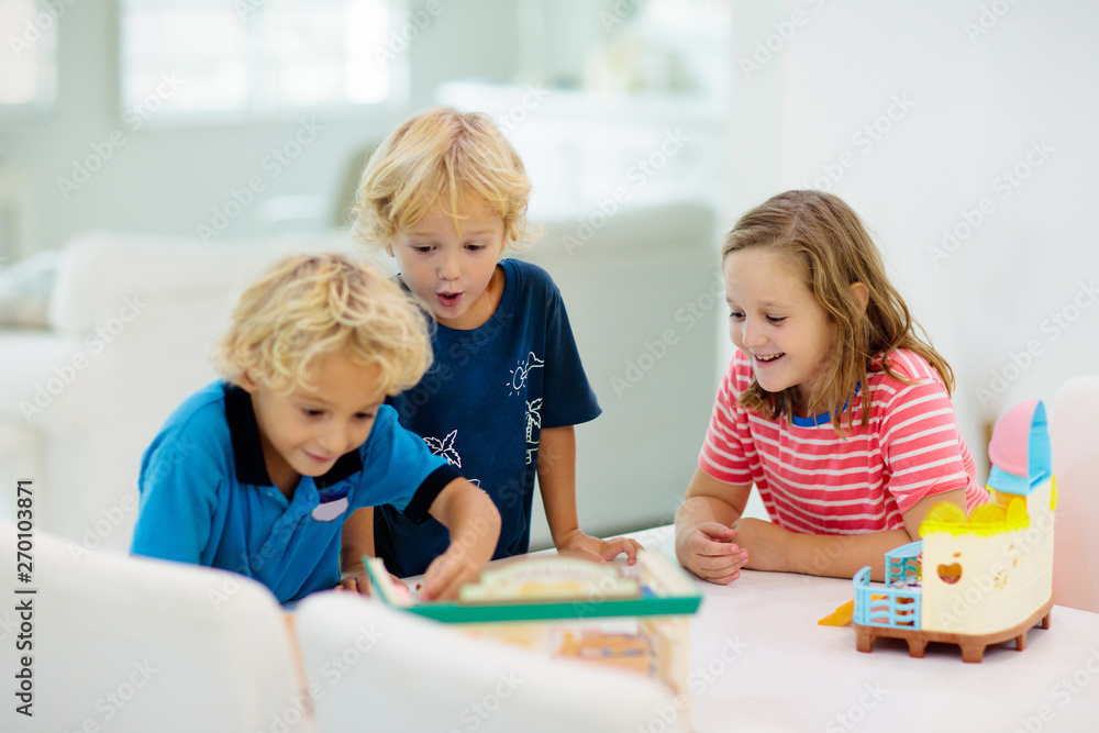 Kids playing board game. Toys for children. Kids playing board game. Toys for children.